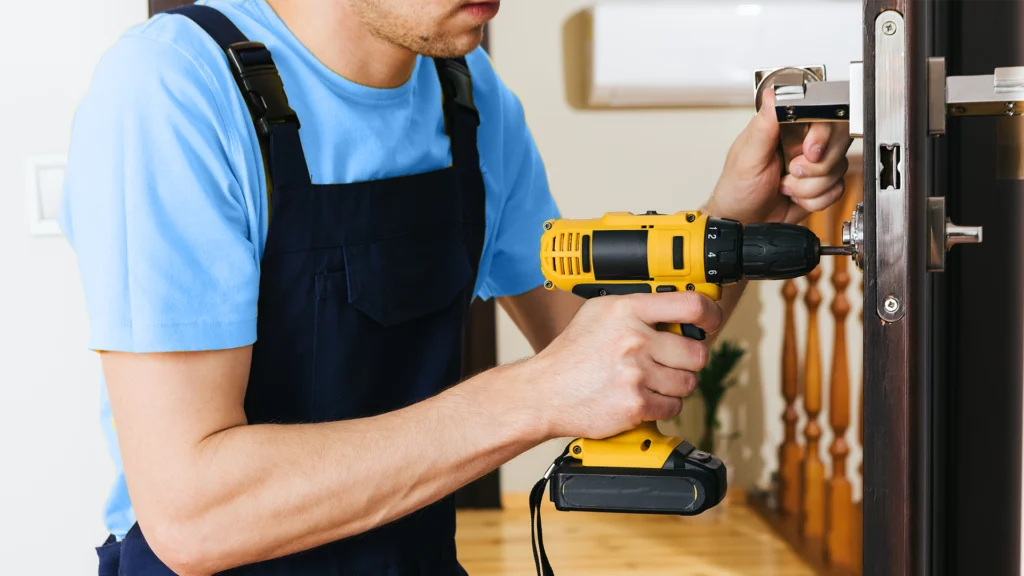 A locksmith changing the doorknob