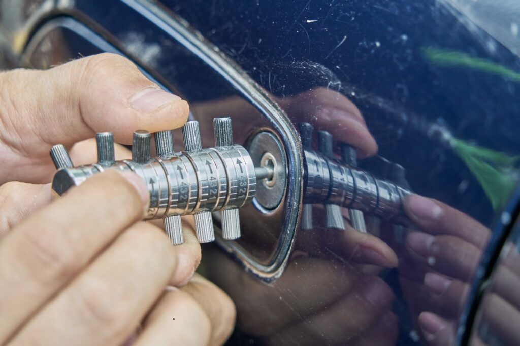 A mobile locksmith unlocking a car