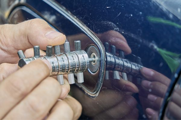 Locksmith using tools for car entry