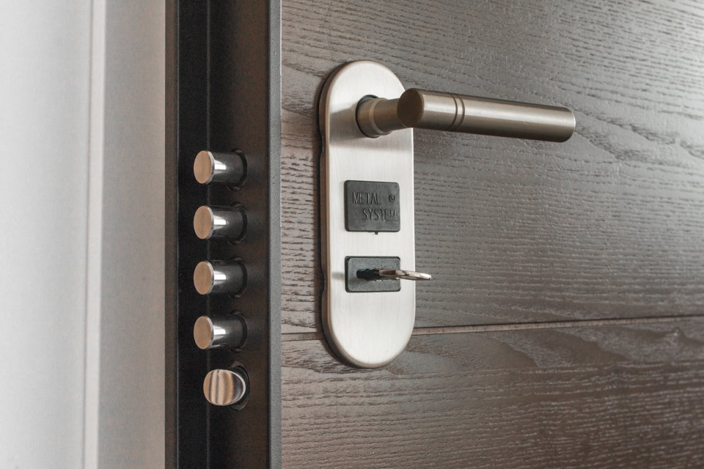 Brass key being inserted into residential door lock