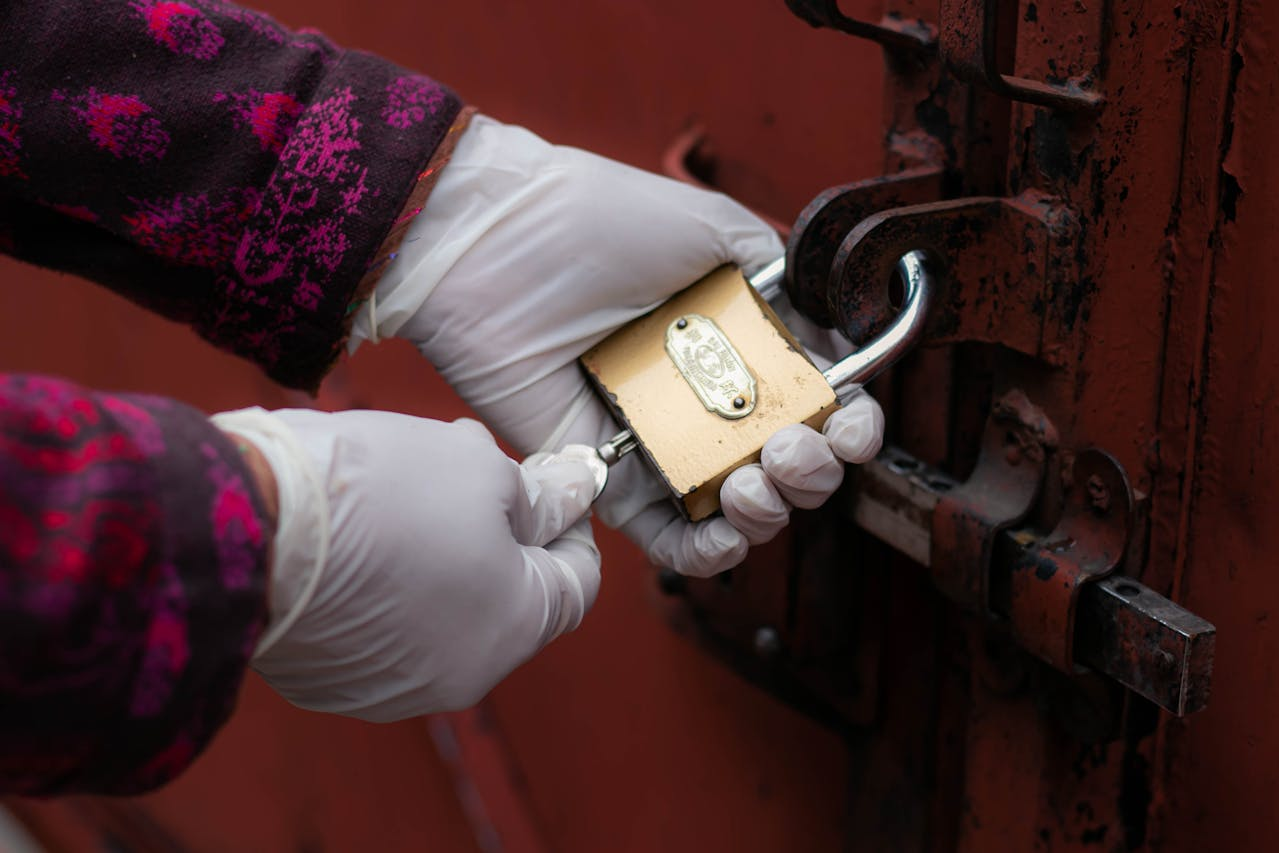 An emergency locksmith opening a rusted lock