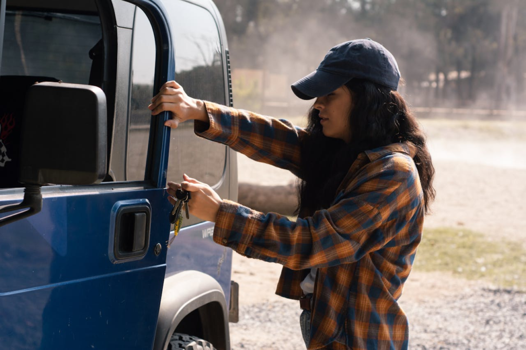 A woman opening her truck after contacting emergency locksmith services