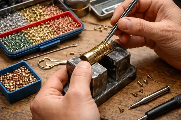 Locksmith servicing a lock cylinder