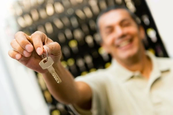 Man holding key for replacement